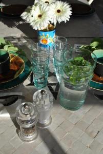 a table with glasses of water and a plate of food at Maison Sidi et Lalla in Essaouira