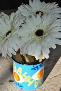 two white flowers in a blue and white bucket at Maison Sidi et Lalla in Essaouira