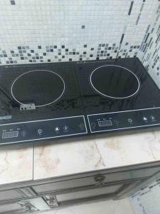 a microwave oven on top of a ceiling at apartment in Ajman for 4 persons near the sea in Ajman 