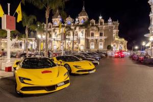 a row of yellow lamborghinis parked in front of a building at MONACO # MENTON - 4 PERSONS - PRIVATE PARKING - FULL RENOVATED - CLIM - CARRE OR - Beach & Sun in Menton