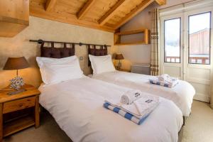 Posteľ alebo postele v izbe v ubytovaní Chalet le Tremplin
