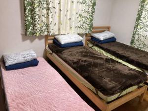 Postel nebo postele na pokoji v ubytování 手ぶらBBQ 京成佐倉駅徒歩6分 生ビールあり 庭600平米 貸切宿泊4LDDK 駐車場3台無料
