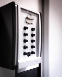 a close up of a black and white refrigerator at Native Apartments Rakowicka 6 in Krakow