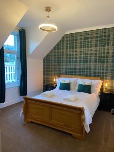 a bedroom with a large bed and a window at AK Lochview Apartment in Fort William