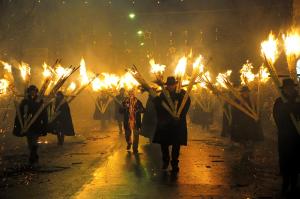 a group of people walking down a street with torches at Il Pentagono in Termoli
