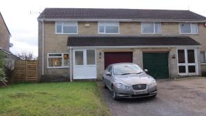 a car parked in front of a house at Templecombe in Temple Combe