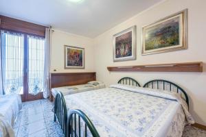 Postel nebo postele na pokoji v ubytování Casa Vacanze Baccolo