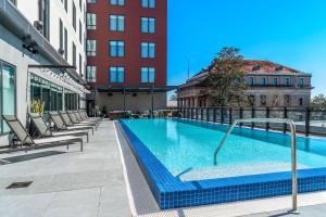 a swimming pool on the roof of a building at Hyatt Place Gainesville Downtown in Gainesville