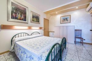 Postel nebo postele na pokoji v ubytování Casa Vacanze Baccolo