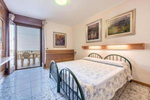 Postel nebo postele na pokoji v ubytování Casa Vacanze Baccolo