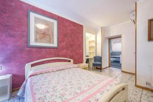 Postel nebo postele na pokoji v ubytování Casa Vacanze Baccolo