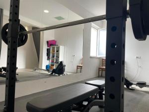 a room with a gym with a mirror at Dela in Hvar