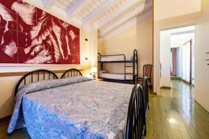 Postel nebo postele na pokoji v ubytování Casa Vacanze Baccolo