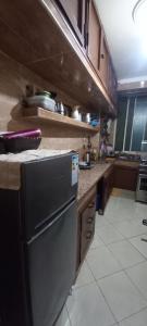 a kitchen with a dishwasher and a counter top at Chambre privé private room Aéroport Mohamed 5 in Deroua