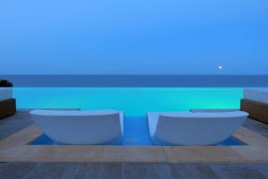 two toilets sitting in front of a swimming pool at International Hotel Casino & Tower Suites in Golden Sands