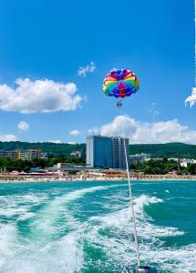 a colorful umbrella on the back of a boat in the water at International Hotel Casino & Tower Suites in Golden Sands