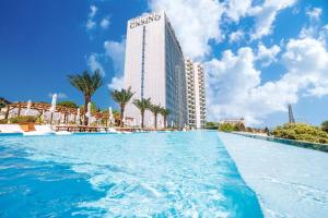 a swimming pool in front of a tall building at International Hotel Casino & Tower Suites in Golden Sands