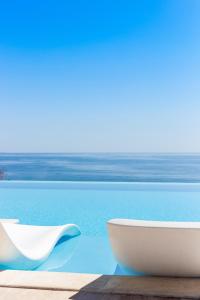 a white bowl sitting on a table next to a pool at International Hotel Casino & Tower Suites in Golden Sands