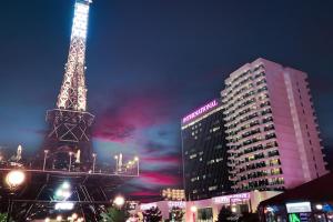 a view of the eiffel tower at night at International Hotel Casino & Tower Suites in Golden Sands