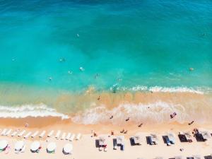 an aerial view of a beach with chairs and the ocean at International Hotel Casino & Tower Suites in Golden Sands