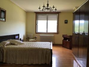 Ένα ή περισσότερα κρεβάτια σε δωμάτιο στο Casa Tino 2
