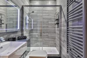 a bathroom with a shower and a sink at The Hepburn - Top Floor - Luxury for up to 6 guests near Open Air Theatre and North Bay in Scarborough