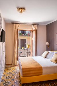 Postel nebo postele na pokoji v ubytování Hotel Piazza Di Spagna