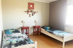 Postel nebo postele na pokoji v ubytování Apartments Hemer