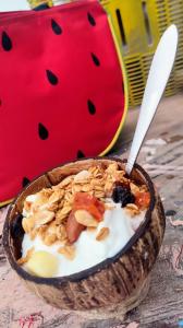 a bowl of yogurt with nuts on top of it at Tu Casa en el Caribe in Canc&uacute;n