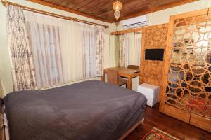 Ліжко або ліжка в номері Kum Butik hotel