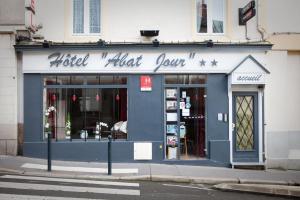 a building with a blue storefront with a store at Hotel Abat Jour in Nantes