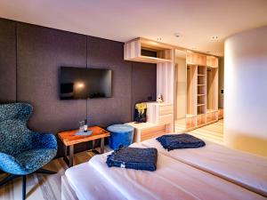 تلفاز و/أو أجهزة ترفيهية في HAUSEREI Design & Kräuterhotel