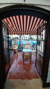 a view of a patio with a table and chairs at Apartamento Hakuna Matata in Costa Del Silencio