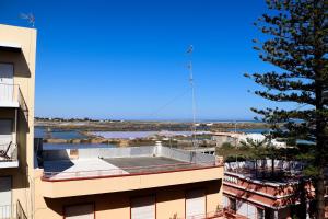 a view of a building with a antenna on the roof at Cantinho dos avós in Fuzeta