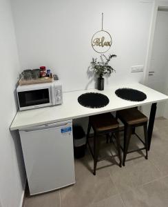 Una cocina o zona de cocina en Apartamentos Los Cabezuelos, Dream Views