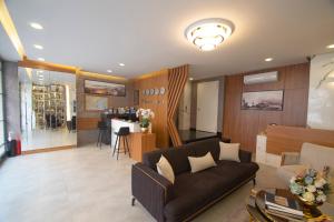 a living room with a couch and a table at KA Hotel & Suites in Istanbul
