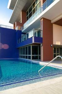 The swimming pool at or close to Apartment with roof top pool.