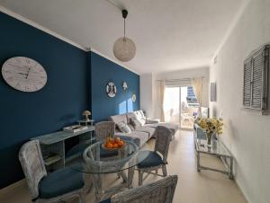 a living room with a couch and a table at Apartment Mar Augusta in Calpe