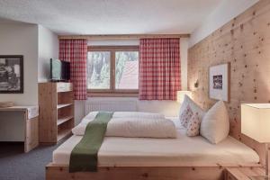 Postel nebo postele na pokoji v ubytování Bio Hotel Stillebach