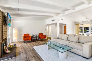 a living room with a couch and a table at Mirage Cove in Rancho Mirage