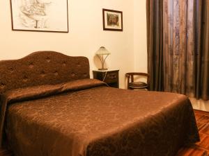 A bed or beds in a room at Casa Vacanze Scalone
