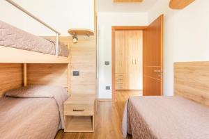 Postel nebo postele na pokoji v ubytování CROSINA HOLIDAY - Casa Lucia