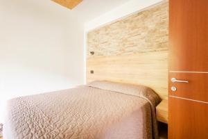 Postel nebo postele na pokoji v ubytování CROSINA HOLIDAY - Casa Lucia