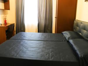A bed or beds in a room at Casa Vacanze Scalone