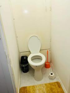 a small bathroom with a toilet in a stall at Rebeka 2 in Nyíregyháza