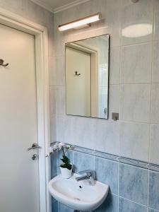 a bathroom with a sink and a mirror at Studio apartment MAR 1 in Dubrovnik