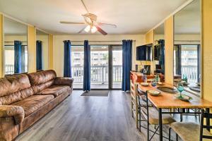 a living room with a couch and a table at Seaside Corpus Christi Condo at The Villa del Sol! in Corpus Christi