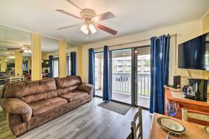 a living room with a couch and a ceiling fan at Seaside Corpus Christi Condo at The Villa del Sol! in Corpus Christi