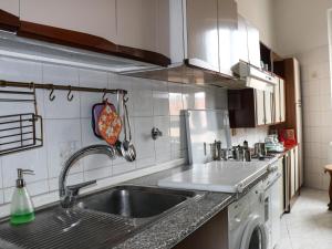 A kitchen or kitchenette at Casa Vacanze Scalone
