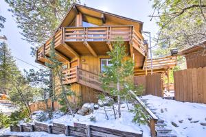 a log cabin in the woods in the snow at Cabin with Mtn Views and Deck, 5 Min To Arrowbear Lake! in Arrowbear Lake